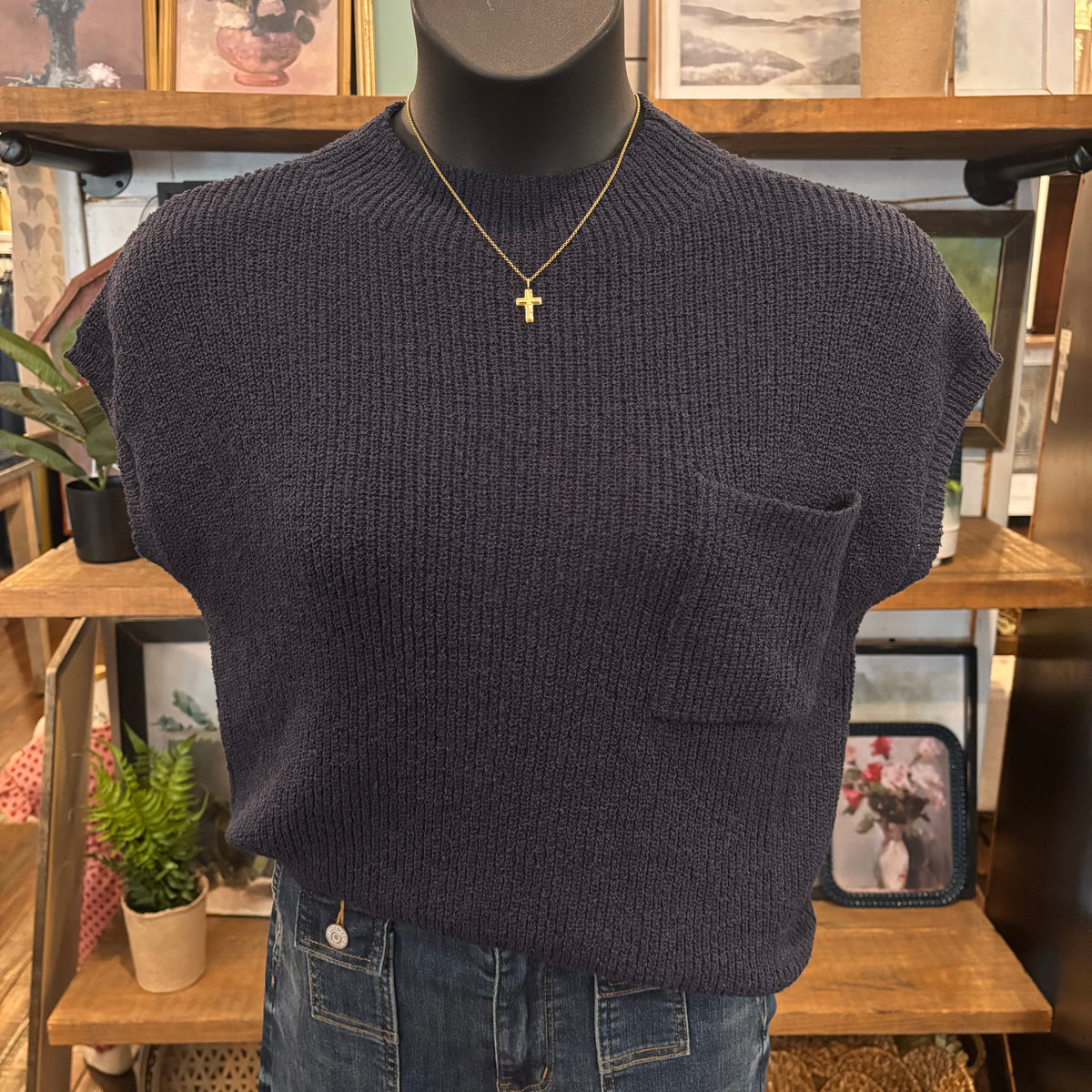 Navy short-sleeve knit sweater top with pocket on mannequin