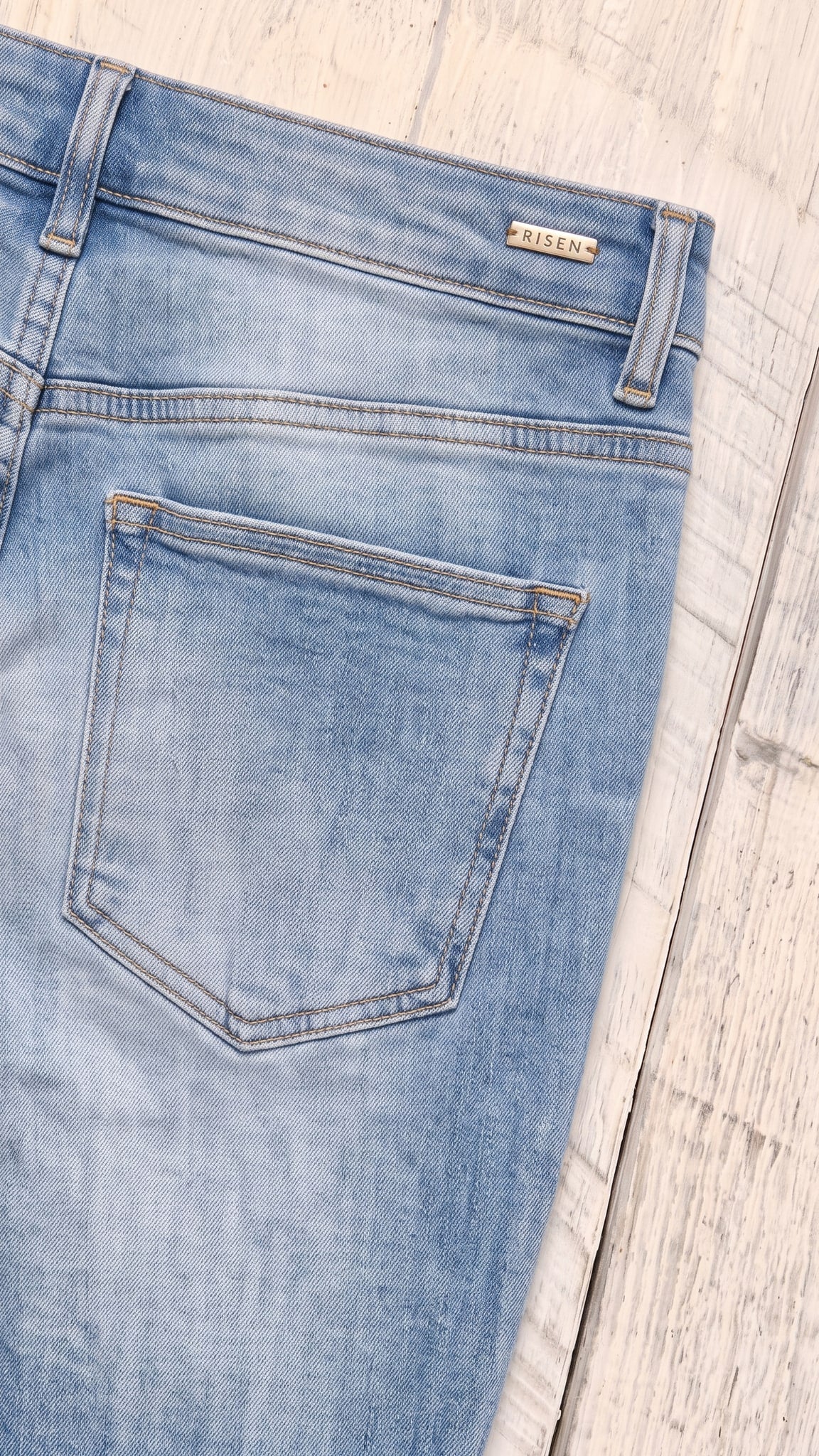 Risen High Rise Flare Jeans | Medium — Back pocket detail