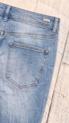 Risen High Rise Flare Jeans | Medium — Back pocket detail