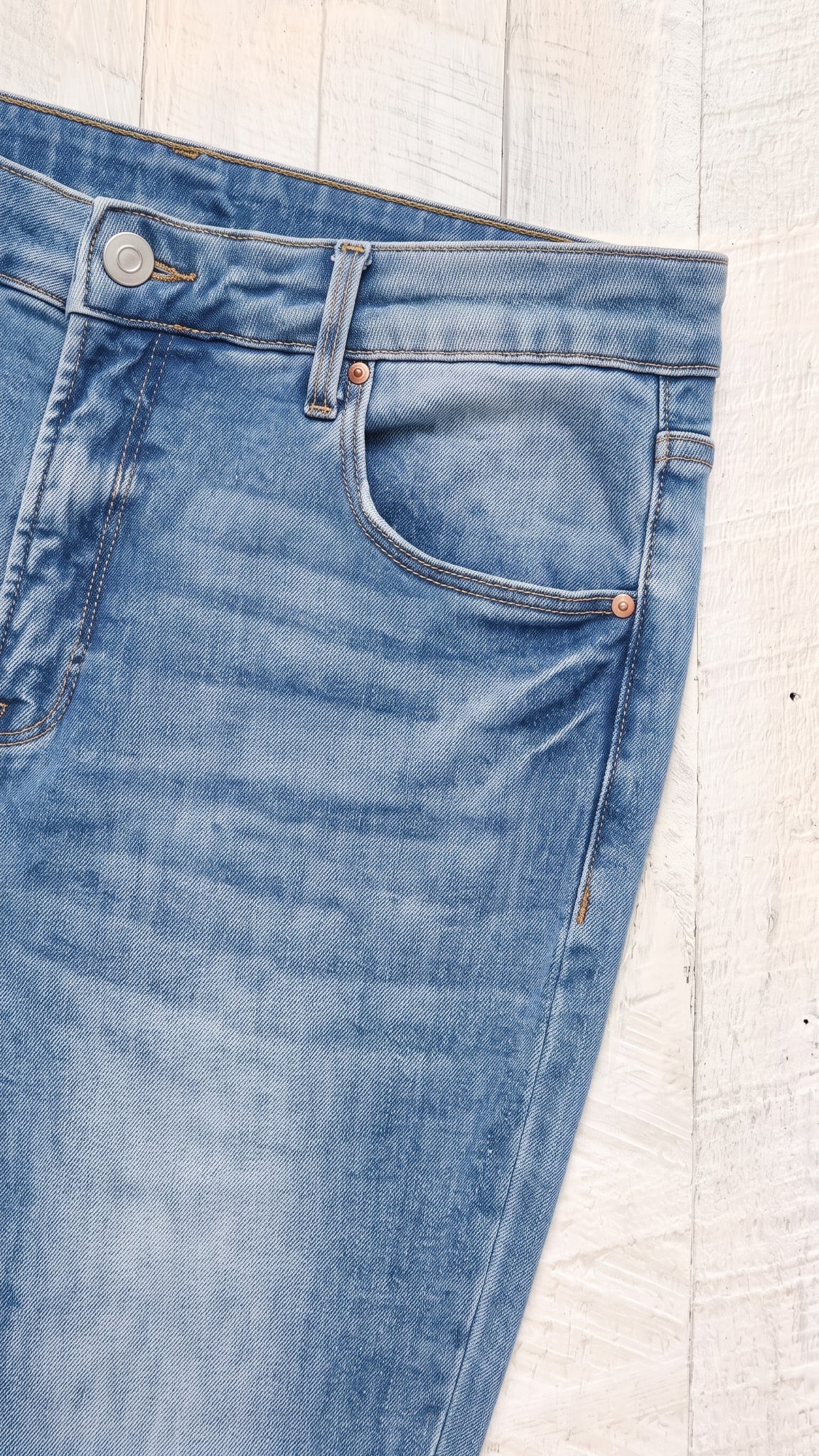 Risen High Rise Flare Jeans | Medium — Front pocket detail