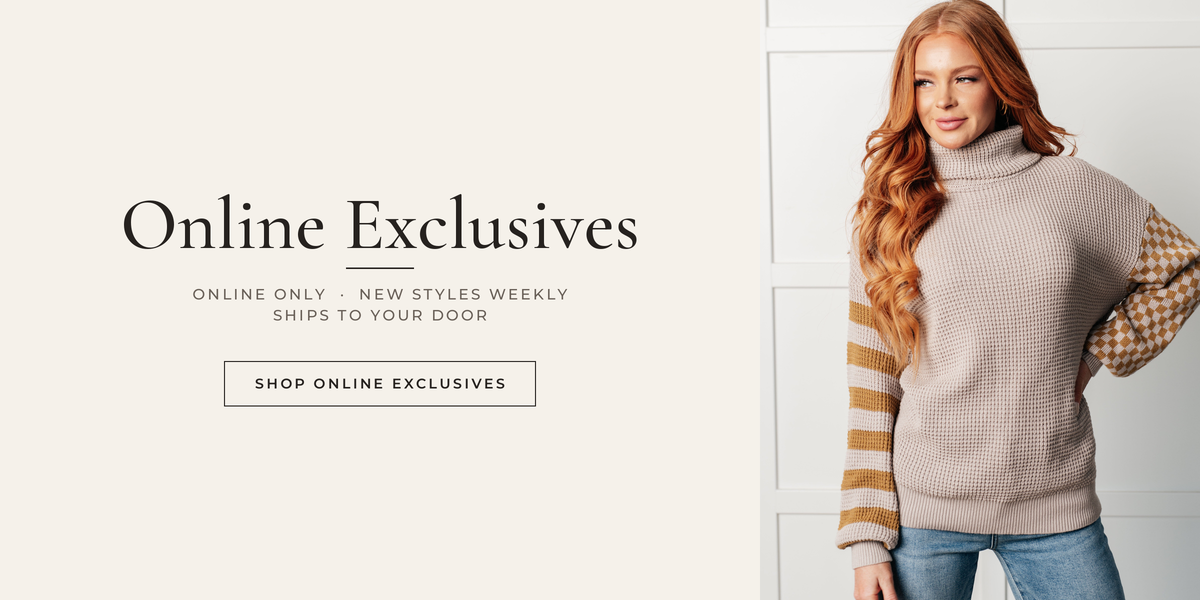 Online Exclusives: model in an oversized taupe waffle-knit sweater with striped and checkered sleeves